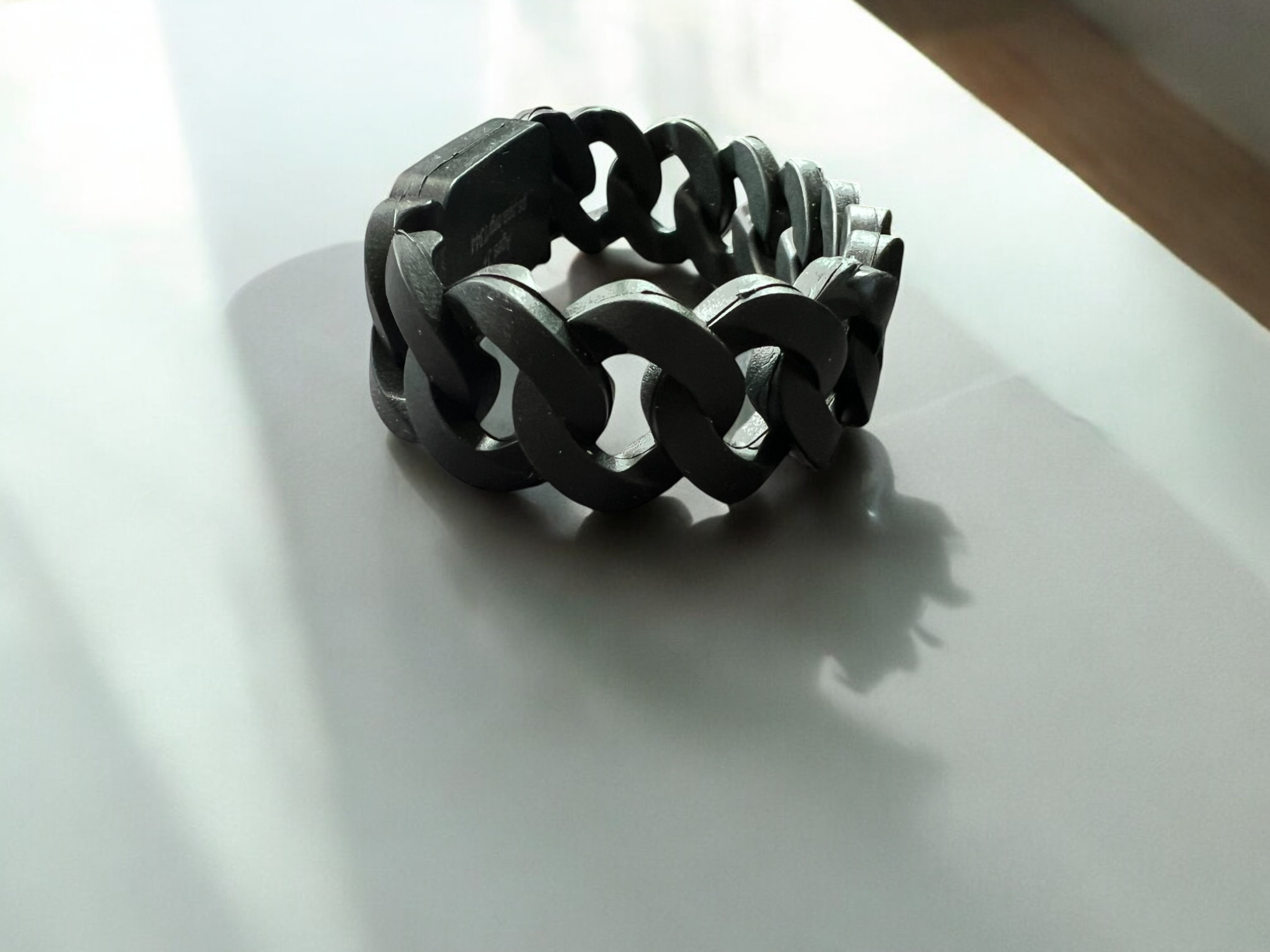 Black chain bracelet with 'Talk for 5' tag on a white surface, perfect for corporates, organizations and schools