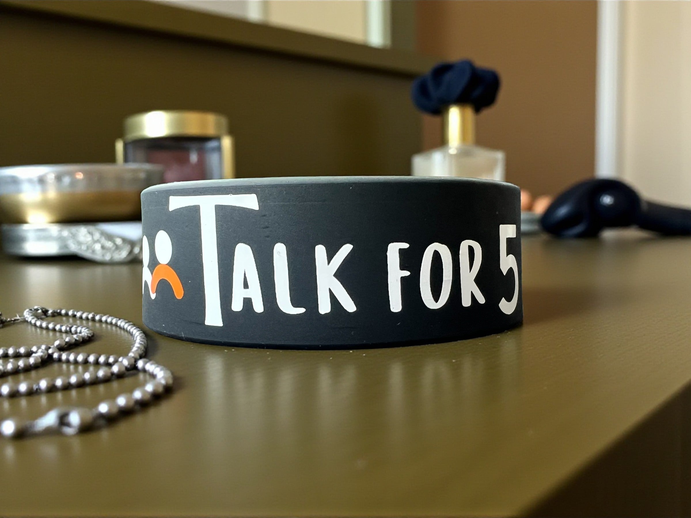 Talk for 5 signature wristband with a minimal design logo to spread love, support and encourage conversations.