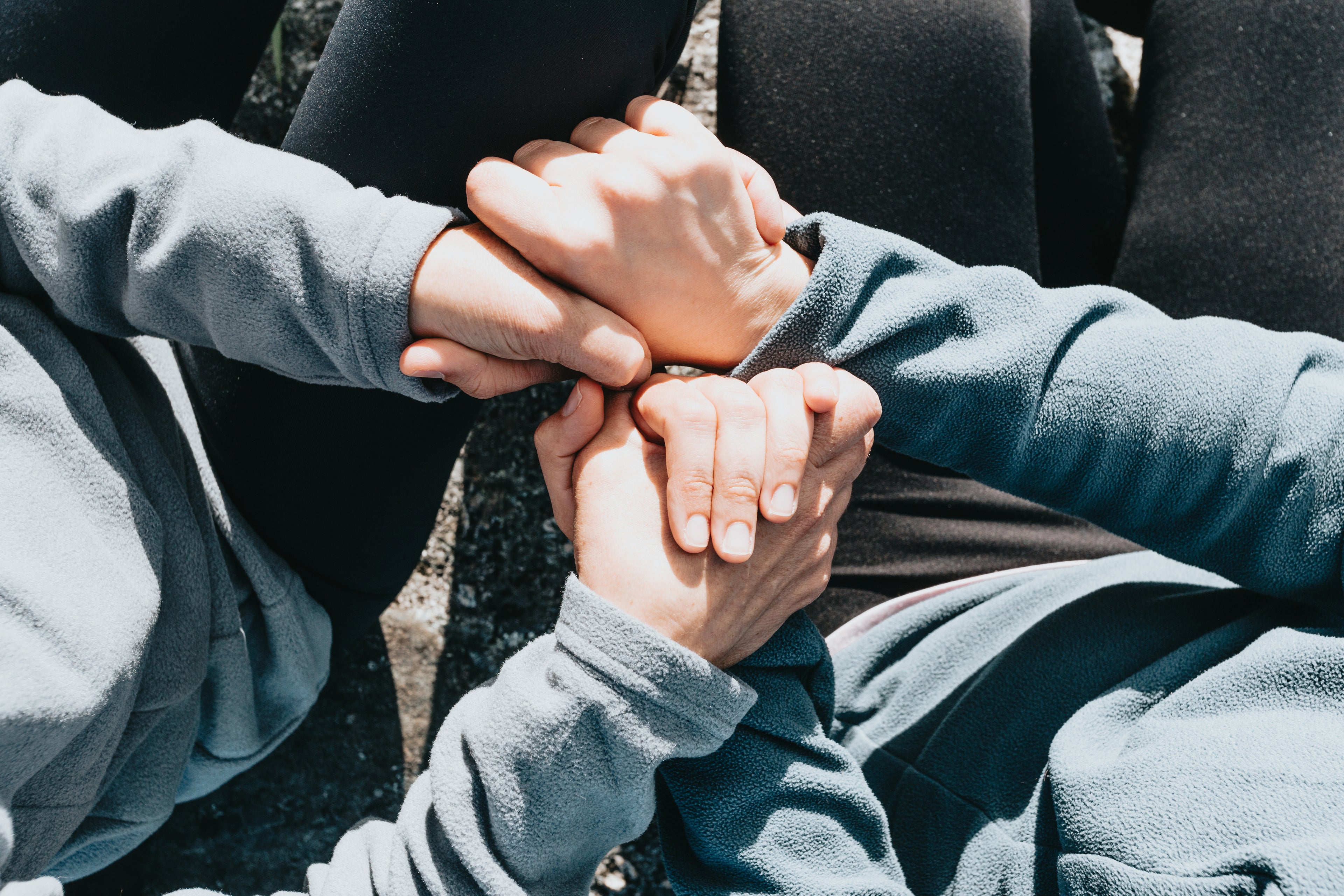 Two people holding hands with love and care - showing what Talk for 5 can do